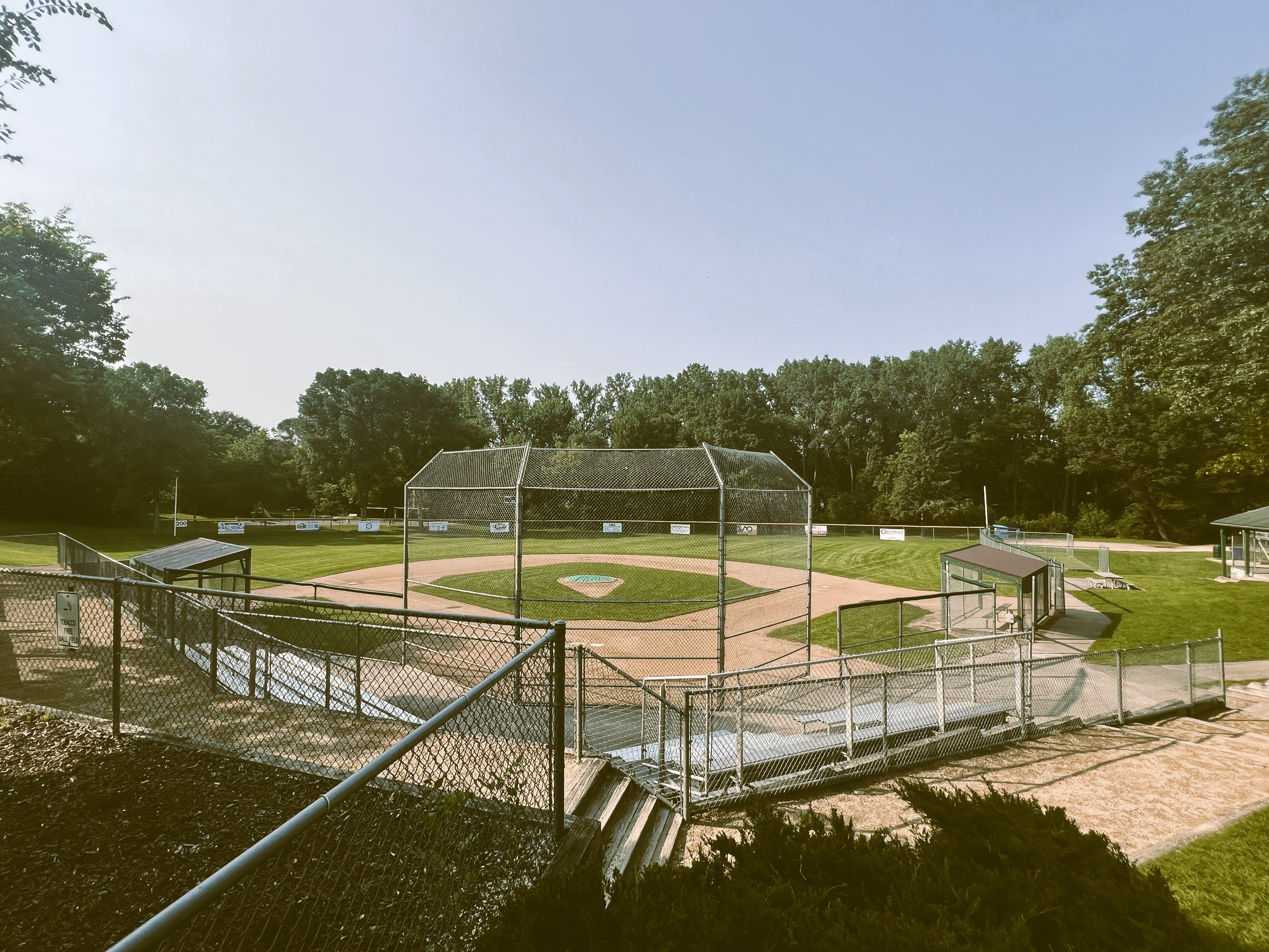 Youth baseball field on a sunny summer evening